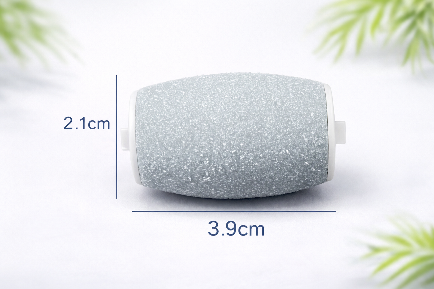 Small cylindrical glittery object with dimensions labeled on a white background with green foliage.